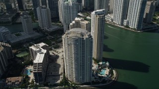 5K aerial stock footage of flying by skyscrapers on the shore of Brickell Key, Downtown Miami, Florida Aerial Stock Footage | AX0031_037