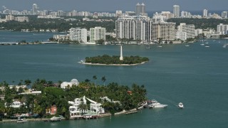 AX0031_045 - 5K aerial stock footage of flying by Flagler Monument Island, Biscayne Bay, Miami Beach, Florida