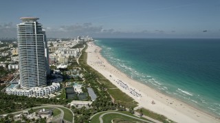 5K aerial stock footage of flying by the beach along the coast, South Beach, Miami Beach, Florida Aerial Stock Footage | AX0031_050