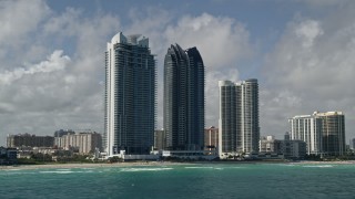 5K aerial stock footage of flying by Jade Ocean, Jade Beach condominiums, Sunny Isles Beach, Florida Aerial Stock Footage | AX0031_078