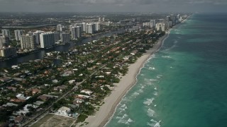 5K aerial stock footage of approaching residential neighborhood on the shore, Golden Beach, Florida Aerial Stock Footage | AX0031_086E