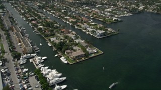 AX0031_110 - 5K aerial stock footage of flying by mansions on the river, Fort Lauderdale, Florida