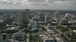 AX0031_122E - 5K aerial stock footage of flying away from and orbiting downtown skyscrapers, Fort Lauderdale, Florida