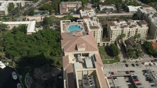 AX0031_125E - 5K aerial stock footage of orbiting top of a condominium complex, Downtown Fort Lauderdale, Florida