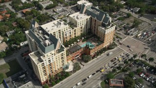 AX0031_130 - 5K aerial stock footage of approaching condominium complex, tilt down, Downtown Fort Lauderdale, Florida