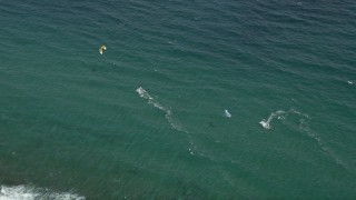 5K aerial stock footage of flying by kite surfers off the coast, Hillsboro Beach, Florida Aerial Stock Footage | AX0031_158