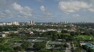 5K aerial stock footage fly over Pompano Community Park, approach condos, Pompano Beach, Florida Aerial Stock Footage | AX0032_001