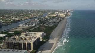 AX0032_013E - 5K aerial stock footage of flying over the beach, revealing more of Hillsboro Beach, Florida