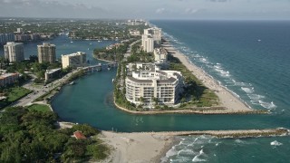 AX0032_020 - 5K aerial stock footage approach condominium complex by inlet to Lake Boca Raton, Boca Raton, Florida