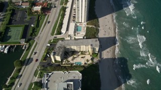 5K aerial stock footage of flying over condominium  complexes by the beach, Boca Raton, Florida Aerial Stock Footage | AX0032_024