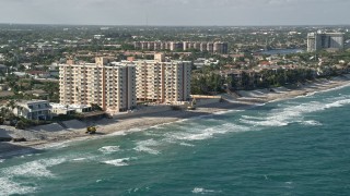 5K aerial stock footage flyby apartment buildings on the beach, Highland Beach, Florida Aerial Stock Footage | AX0032_032