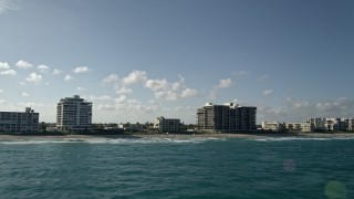 AX0032_039 - 5K aerial stock footage of flying by apartments, condominiums near beach, Highland Beach, Florida