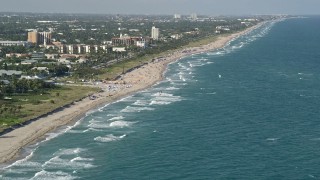 AX0032_042 - 5K aerial stock footage of flying over kite surfers near beach, Delray Beach, Florida