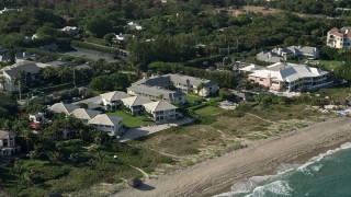 5K aerial stock footage of passing condominiums by the beach, Delray Beach, Florida Aerial Stock Footage | AX0032_046