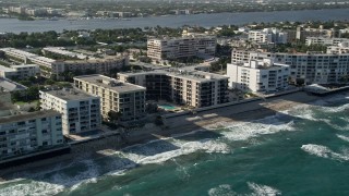 5K aerial stock footage of apartment building on the coast, Palm Beach, Florida Aerial Stock Footage | AX0032_061