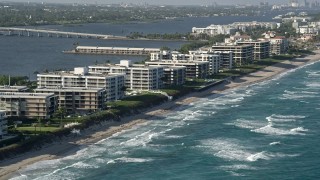 5K aerial stock footage of flying by coastal condominium complexes, Palm Beach, Florida Aerial Stock Footage | AX0032_063