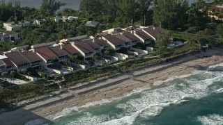 5K aerial stock footage of passing condominiums by the beach, Palm Beach, Florida Aerial Stock Footage | AX0032_069