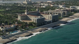 5K aerial stock footage of approaching The Breakers Palm Beach hotel in Palm Beach, Florida Aerial Stock Footage | AX0032_080