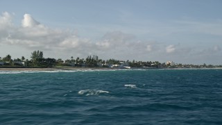 AX0032_107 - 5K aerial stock footage of flying by homes on the shore, Palm Beach, Florida