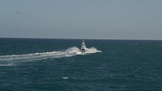 5K aerial stock footage of tracking a fishing boat sailing across the Atlantic, Jupiter, Florida Aerial Stock Footage | AX0032_138E