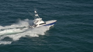 5K aerial stock footage of tracking a fishing boat on the Atlantic Ocean, Jupiter, Florida Aerial Stock Footage | AX0032_140E