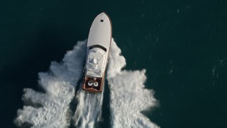 AX0032_142E - 5K aerial stock footage of a fishing boat sailing the Atlantic, Jupiter, Florida