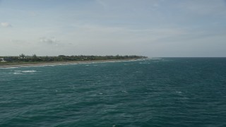 AX0032_151 - 5K aerial stock footage of flying by the coast, Hobe Sound, Florida