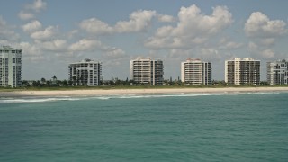 5K aerial stock footage fly by beachfront apartment buildings, Fort Pierce, Florida Aerial Stock Footage | AX0033_043