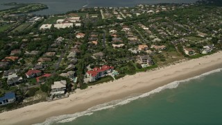 AX0033_057 - 5K aerial stock footage fly away from a residential beachside neighborhood, Vero Beach, Florida