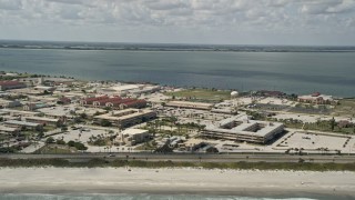 AX0034_006 - 5K aerial stock footage of flying by the buildings at Patrick Air Force Base, Florida