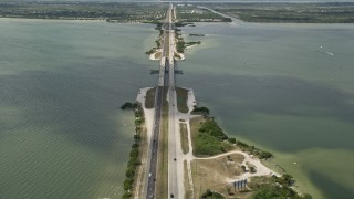 AX0034_021 - 5K aerial stock footage tilt up from Bennett Causeway revealing Merritt Island, Florida