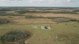 5K aerial stock footage of flying over marshland, Wedgefield, Florida Aerial Stock Footage | AX0034_067E