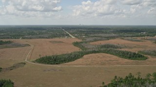 5K aerial stock footage video fly over marshland toward town, Wedgefield, Florida Aerial Stock Footage | AX0034_069