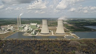 5K aerial stock footage of flying by a coal fired power generation facility, Orlando, Florida Aerial Stock Footage | AX0034_080