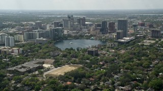 AX0034_085 - 5K aerial stock footage of Lake Eola and Downtown Orlando, Florida