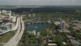 5K aerial stock footage of Lake Lucerne next to the Expressway, Downtown Orlando. Florida Aerial Stock Footage | AX0034_090E