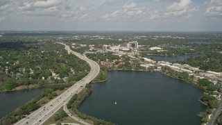 5K aerial stock footage of approaching interstate beside a lake, Orlando, Florida Aerial Stock Footage | AX0034_097