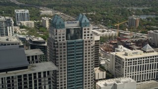 AX0034_109 - 5K aerial stock footage of orbiting the SunTrust Center, Downtown Orlando, Florida