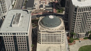 AX0034_110 - 5K aerial stock footage approach and tilt to a bird's eye of Orlando City Hall, Downtown Orlando, Florida