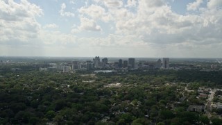 5K aerial stock footage of Downtown Orlando skyline seen from a distance, Florida Aerial Stock Footage | AX0035_001