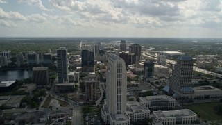 AX0035_004E - 5K aerial stock footage flyby courthouse, office tower and freeway in Downtown Orlando, Florida