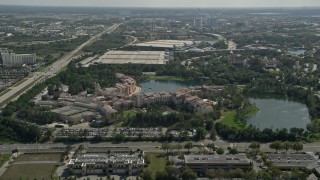 AX0035_013 - 5K aerial stock footage of Loews Portofino Bay resort, Universal Studios, Florida