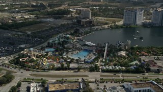 AX0035_024 - 5K aerial stock footage of orbiting Wet 'n Wild water park, Orlando, Florida