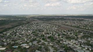 5K aerial stock footage of flying over swamps and residential neighborhoods, Clermont, Florida Aerial Stock Footage | AX0035_083E