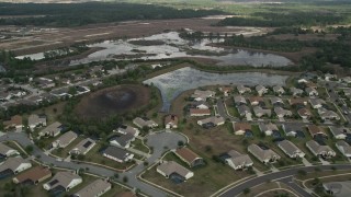 5K aerial stock footage flyby residential neighborhood and wetlands, Clermont, Florida Aerial Stock Footage | AX0035_085