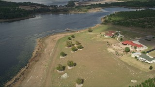 5K aerial stock footage of flying near homes by Lake Avalon, approach dock, Winter Garden, Florida Aerial Stock Footage | AX0035_099