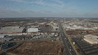 5K aerial stock footage follow Broadhollow Road to approach stores and shopping centers in Farmingdale, Long Island, New York, winter Aerial Stock Footage | AX0065_0002