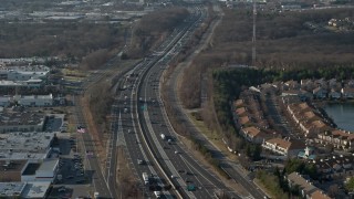 5K aerial stock footage fly over hotel and office building to approach Long Island Expressway in Melville, Long Island, New York, winter Aerial Stock Footage | AX0065_0005E