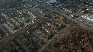 5K aerial stock footage of a bird's eye view of upscale homes and leafless trees, reveal condo complex in Woodbury, Long Island, New York, winter Aerial Stock Footage | AX0065_0010E