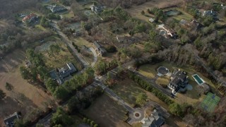 5K aerial stock footage of a bird's eye view of large, upscale homes in Syosset, Long Island, New York, winter Aerial Stock Footage | AX0065_0016